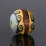 Ancient mosaic glass bead with classical wave pattern